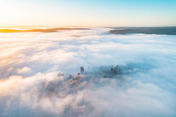 An aerial above a white blanket of cloud cover over the county landscape of Nannup Western Australia