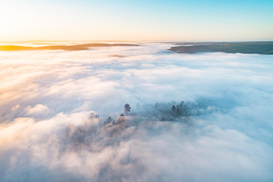 An aerial above a white blanket of cloud cover over the county landscape of Nannup Western Australia