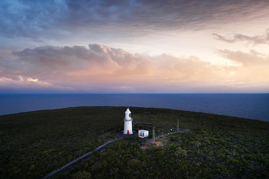 Lighthouse at Cape Naturaliste, South Western Australia, with a pink sunrise overlooking Geographe Bay.